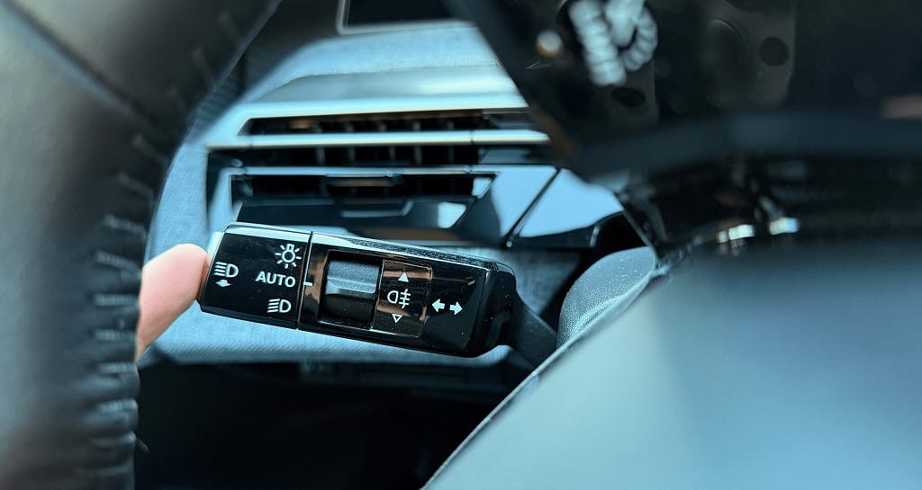 The button to change the instrument cluster view is hidden on the stalk